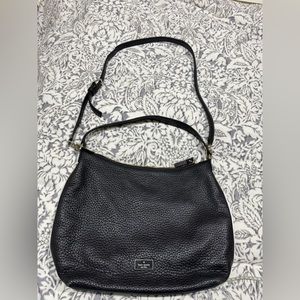 Vintage Kate black leather shoulder and crossbody purse with white trim edge.